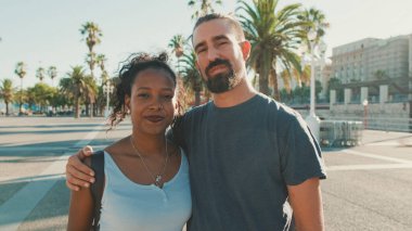 Close-up of interracial smiling couple in love