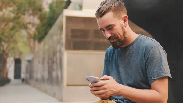 Young Adult Man Beard Uses Phone — Foto Stock