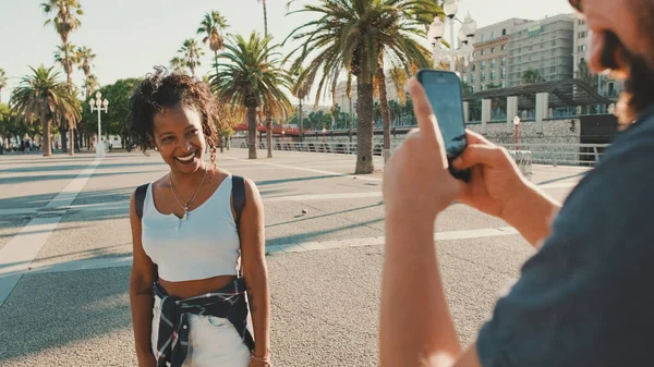 Smiling Interracial Couple Man Takes Picture Video Woman Phone — Zdjęcie stockowe