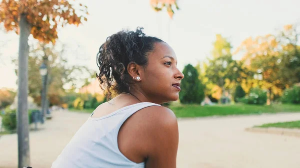 Young Mixed Race Woman Sitting Park Bench Smiling Looking — Φωτογραφία Αρχείου