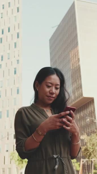 Vertical Video Young Happy Businesswoman Using Mobile Phone While Standing — Stock Video