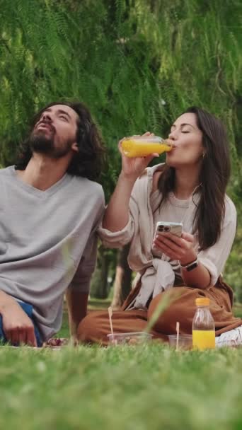 Vertical Video Couple Love Enjoying Drinks Using Mobile Phone — Stock Video