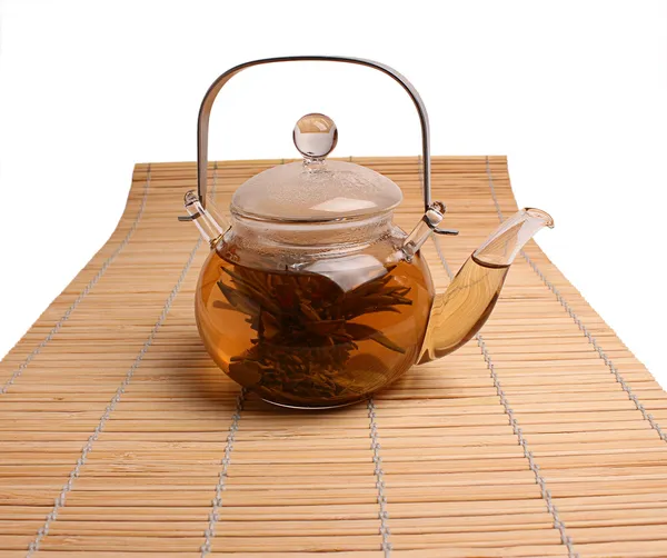 Glass teapot with green tea — Stock Photo, Image