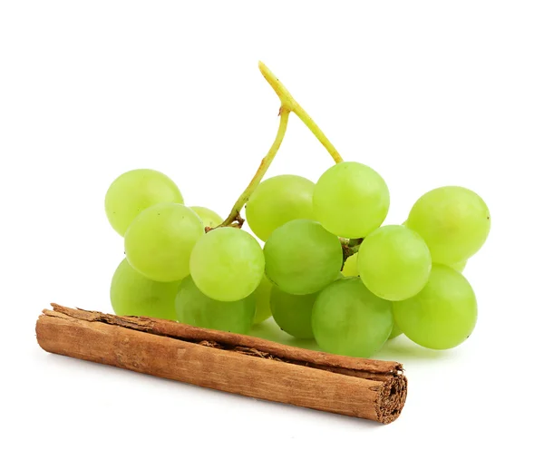 Fresh grapes and cinnamon stick — Stock Photo, Image
