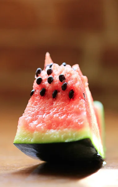 A piece of ripe watermelon on the table. — Stock Photo, Image