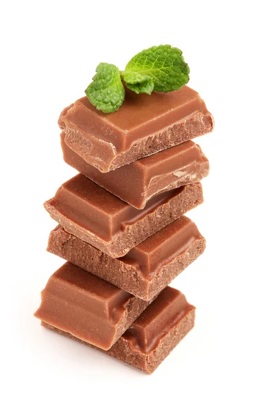 Milk chocolate with a sprig of mint. — Stock Photo, Image