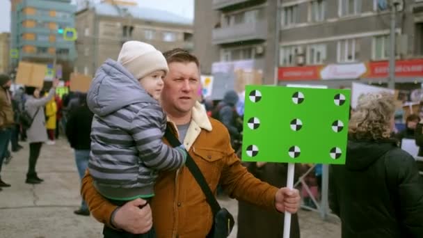 Protesting family of father and kid, single dad and child at political picket. — Stock Video