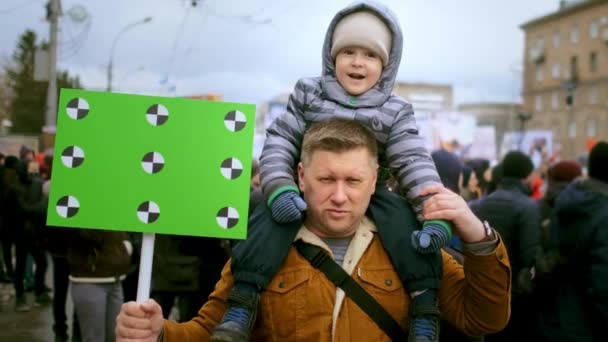Protesting environment saving family. Father and son at plane pollution rally. — Stock Video