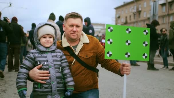 Family of climate change activists at rally with mockup banner. Saving planet. — Stock Video