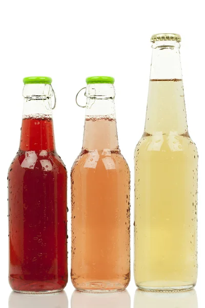 Tres botellas con bebidas de diferentes colores —  Fotos de Stock