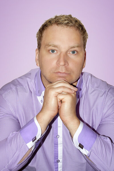 Man dressed in purple shirt on purple background