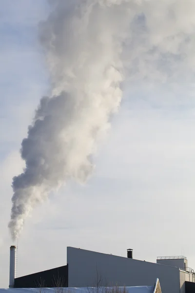 Smoke coming upright out from the industrial buildings in winter — Stock Photo, Image