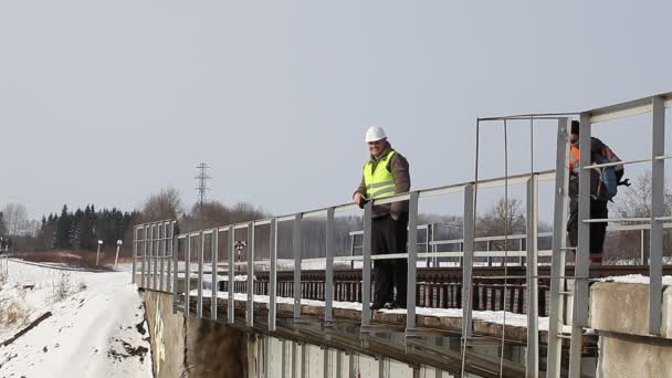 Railroad workers take railway safety inspection — Stock Video