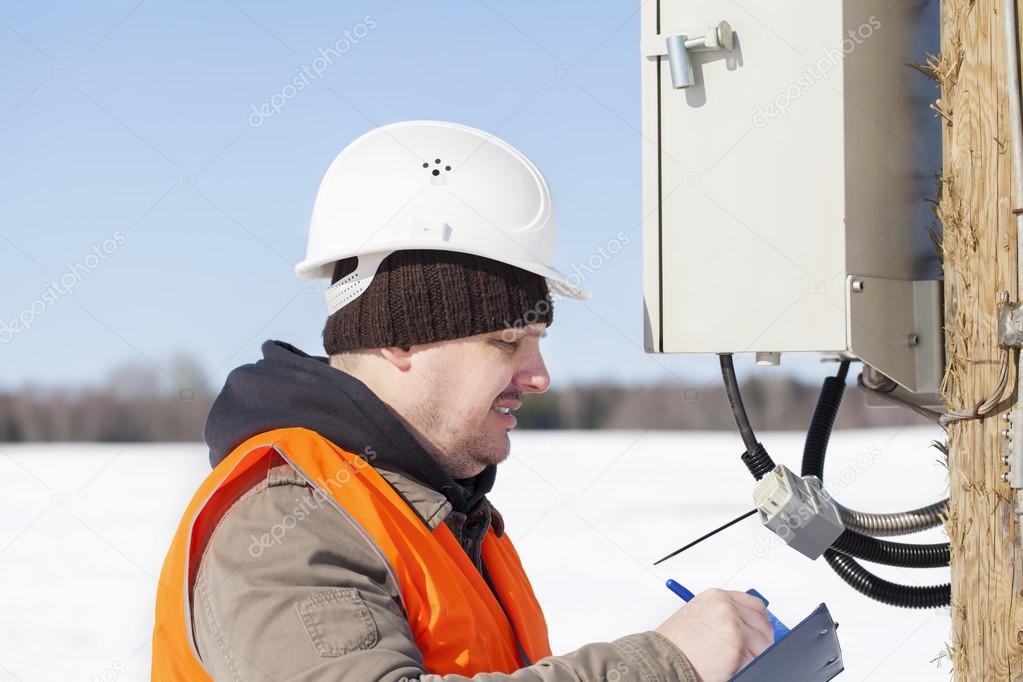Electrical engineer inspect electric lines technical quality