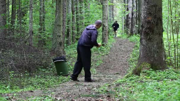 Father and son running along the forest trail episode six — Stock Video