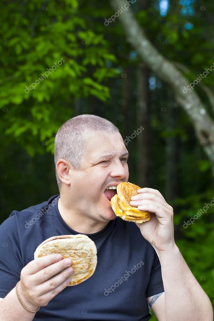 Man With Burger And Kebab In The Hands Stock Photo Image By C Ilze79 Man With Burger And Kebab In The Hands Stock Photo Image By C Ilze79