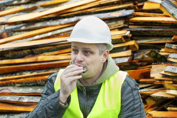 Man plays harmonica — Stock Photo, Image