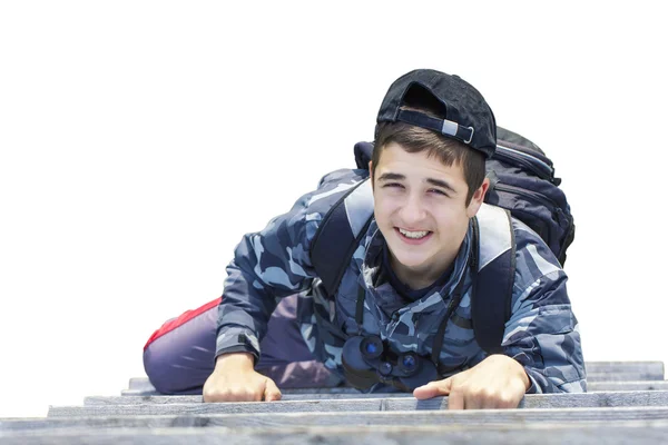 Boy climbing on wooden stairs on a white background — Stock Photo, Image