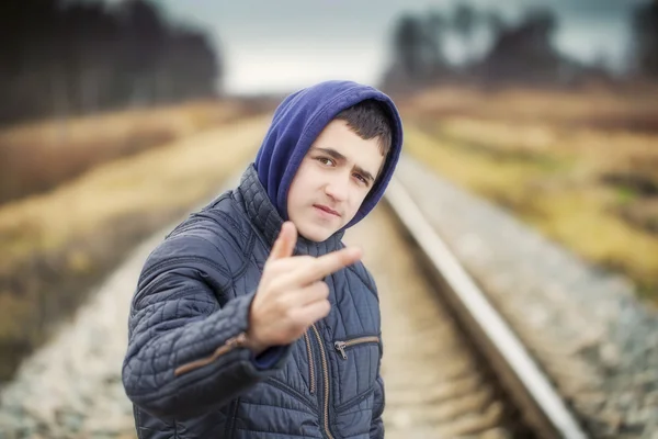 Boy showing middle finger — Stock Photo, Image