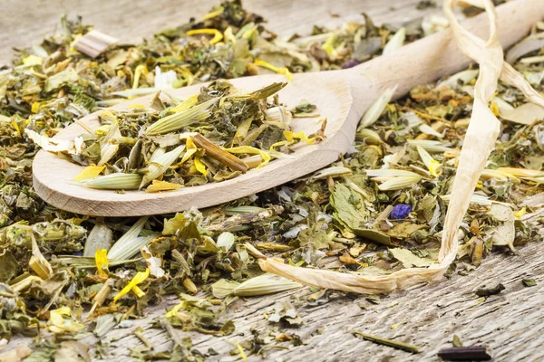 Herbal tea on spoon — Stock Photo, Image