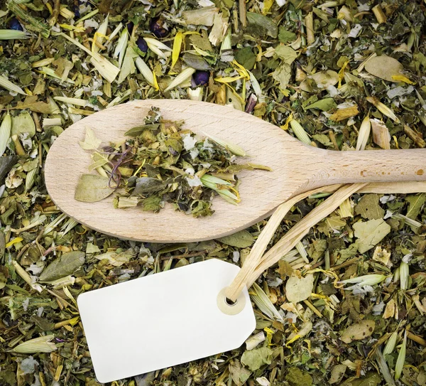 Herbal tea on spoon — Stock Photo, Image