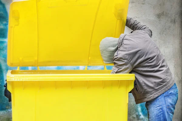 Homeless near container — Stock Photo, Image