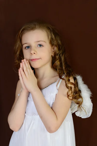 Beautiful little girl with angel wings — Stock Photo, Image