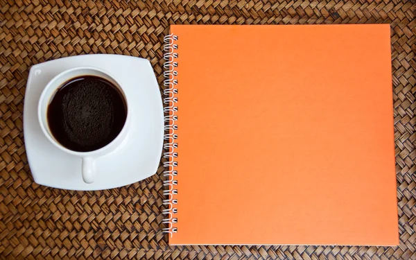 Orange notebook and coffe — Stock Photo, Image