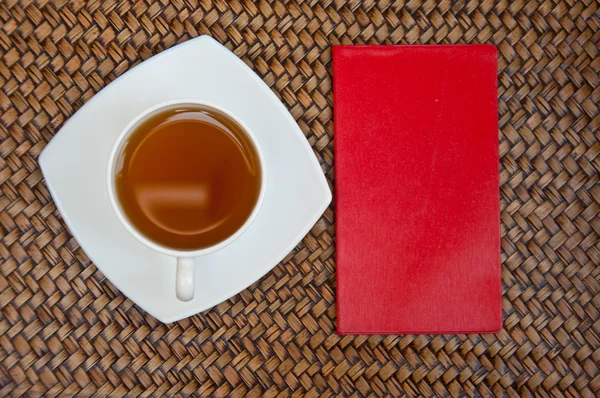 Tea and red notebook — Stock Photo, Image