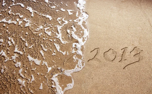 New Year 2013 is coming - numbers written in sand on exotic beach — Stock Photo, Image