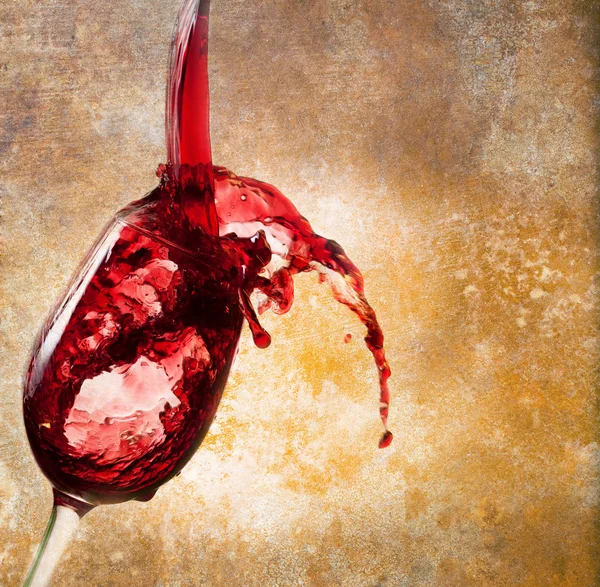 Glass of red wine on vintage background — Stock Photo, Image