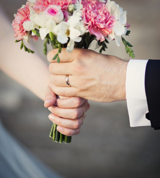 Wedding bouquet at bride's hands