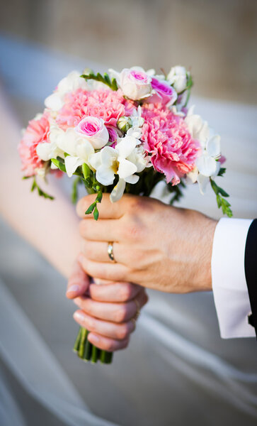 Wedding bouquet at bride's hands