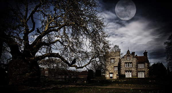 Old hunted building at midnight