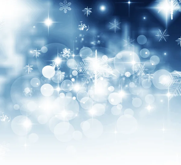 Light abstract Christmas background with white snowflakes — Stock Photo, Image