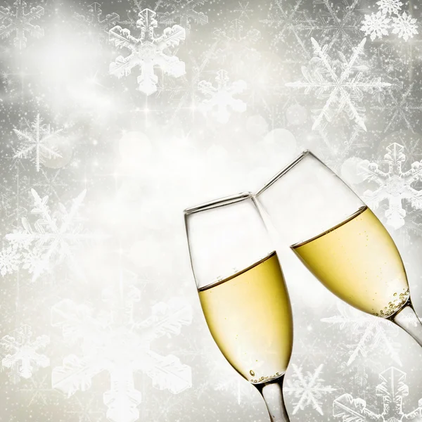 Champagneglas med snöflingor bakgrund — Stockfoto
