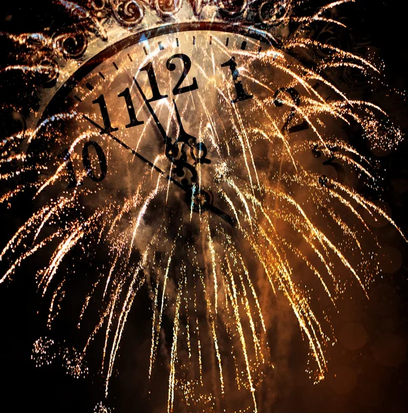 Old vintage clock and fireworks — Stock Photo, Image
