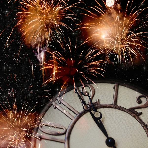 Old vintage clock and fireworks — Stock Photo, Image
