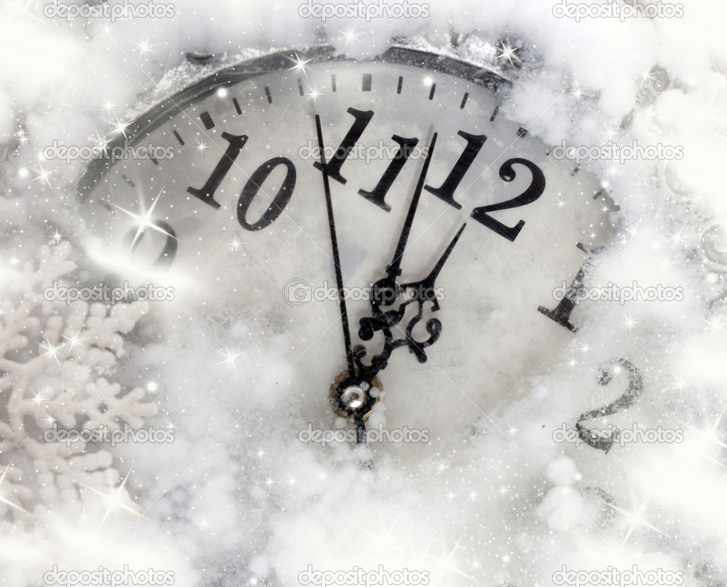 Vintage clock covered with snow
