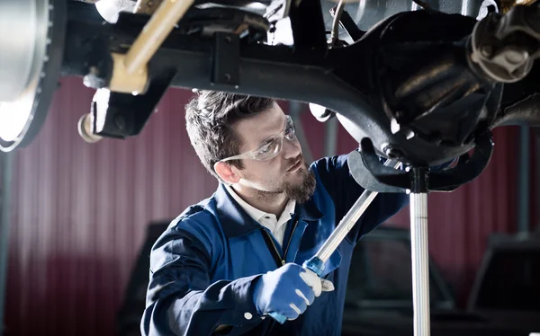Handsome car mechanic at work — Stock Photo, Image