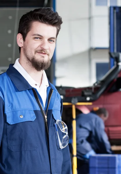 Handsome car mechanic at work — Stock Photo, Image