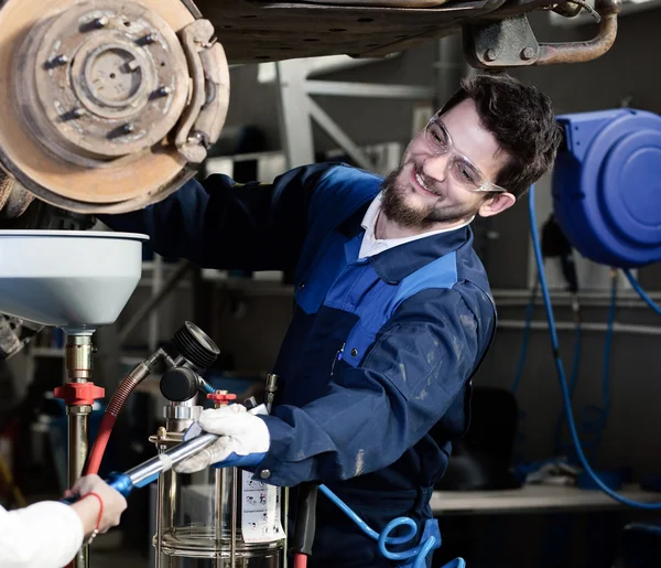 Handsome car mechanic at work — Stock Photo, Image