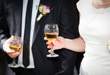 Hands holding wine glasses