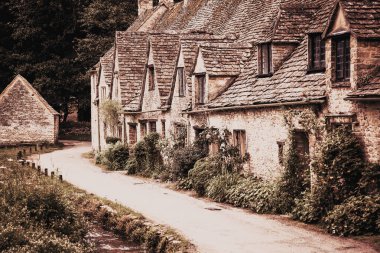 traditional Cotswold cottages in England  UK. Bibury is a village and civil parish in Gloucestershire  England.