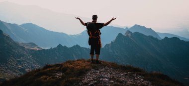 hiker enjoying high mountains view