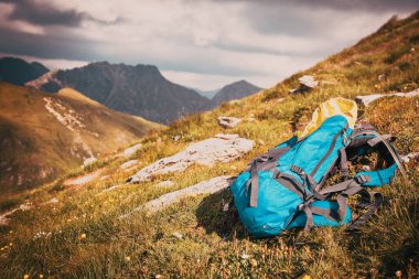 backpack in high mountains hiking and slow travel