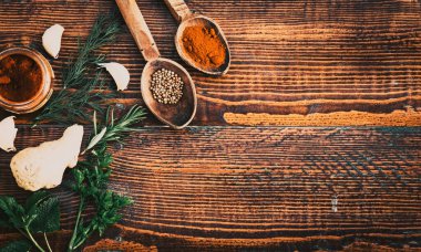 tabletop view of spices  coriander  ginger  parsley  paprika