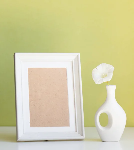 product mock up with white frame with space for text and white vase