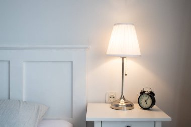 vintage alarm clock in bright bedroom