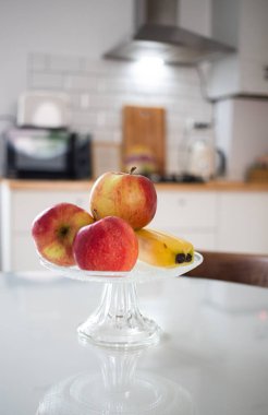 fresh fruit apples and bananas in modern kitchen